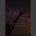 Milky way image with a tower silhouette in the foreground.